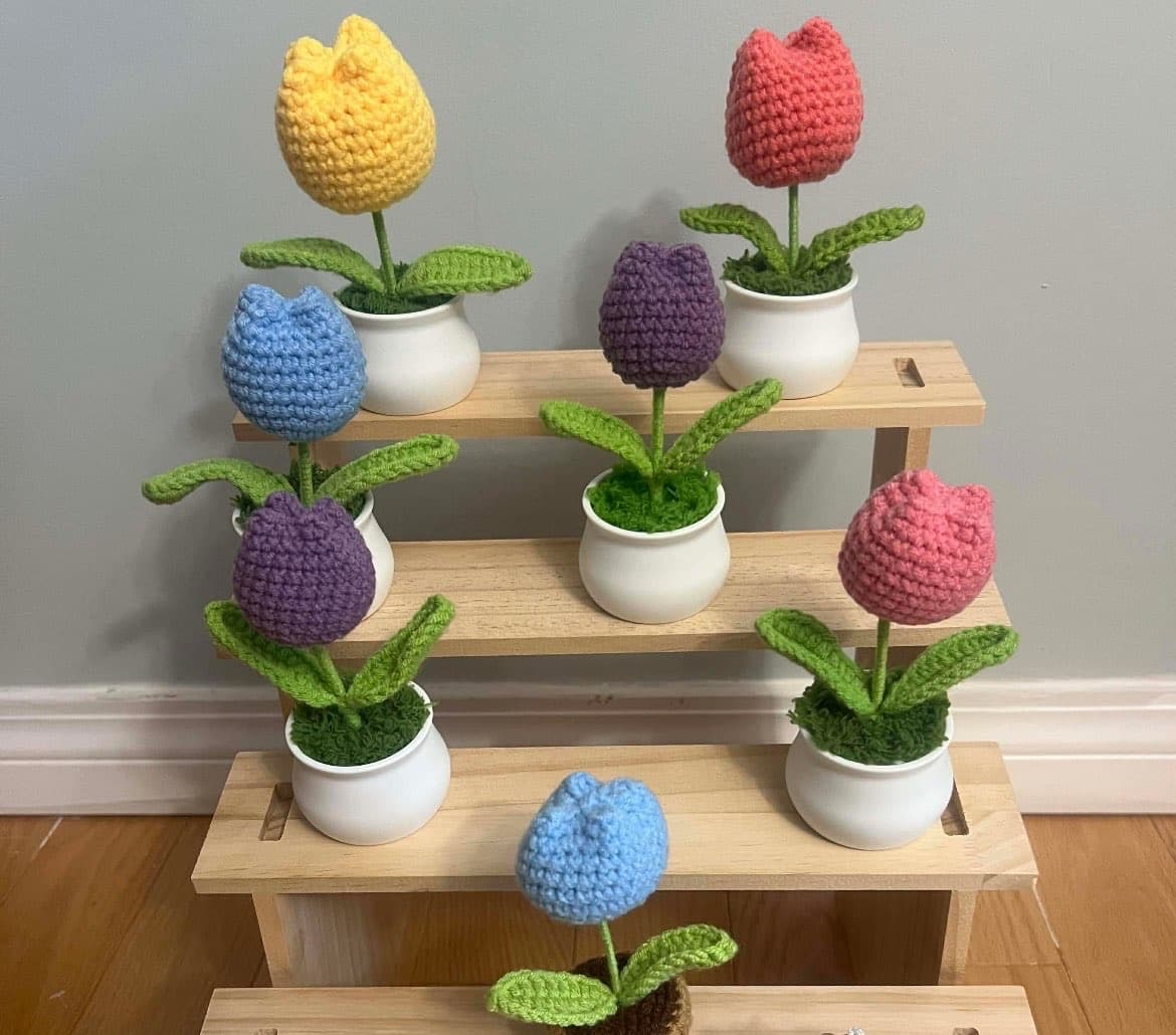 Display of crochet flowers and small handmade pieces