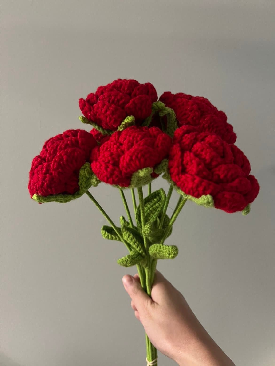 Red crochet flower bouquet display