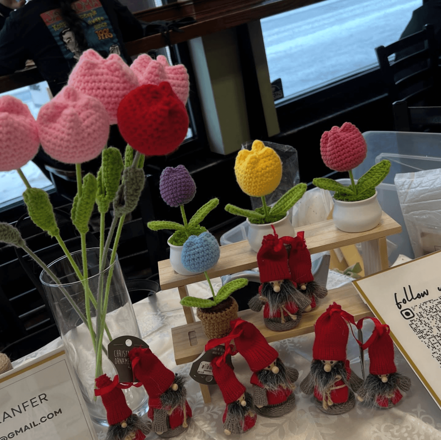 Display of crochet flowers and small handmade pieces